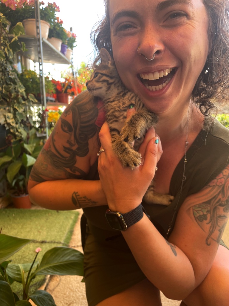 Me happily holding a tabby kitten